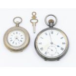 A ladies 800 silver open faced pocket watch, key wind, winds and working,  along with key,