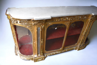 A large 19th century, gilded credenza, having marble top and mirror back, significant losses,