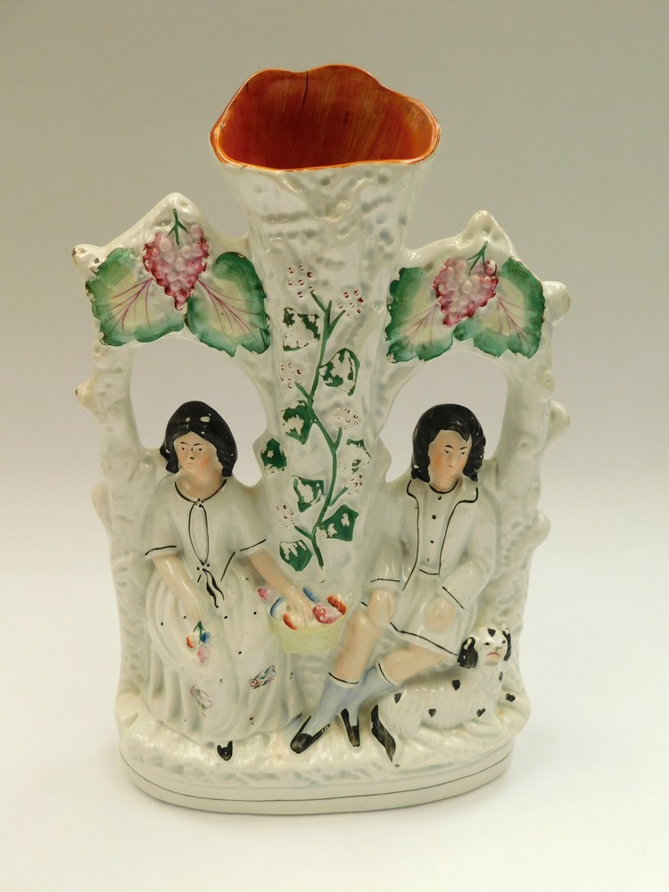 A mid to late 19th century Staffordshire figure of lovers, crack to top , minor colour losses