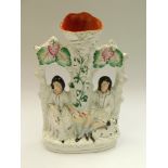 A mid to late 19th century Staffordshire figure of lovers, crack to top , minor colour losses