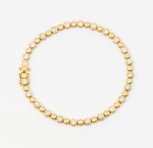 A diamond and 18ct gold line bracelet, comprising alternate bead and round brilliant cut diamond