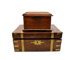 A Victorian mahogany writing box with brass supports along with a 19th Century oak box.