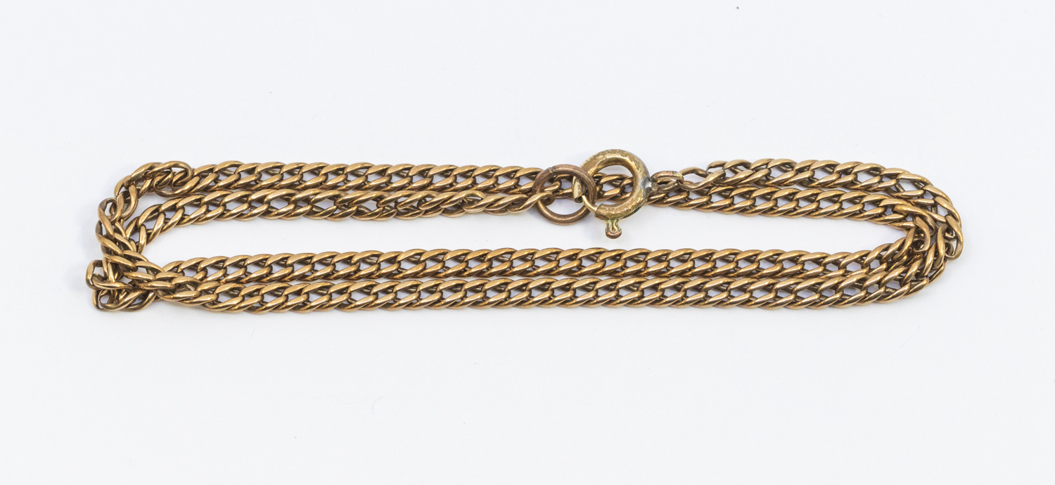 An unmarked yellow metal chain, probably 9ct gold,  with later base metal clasp, weight approx 9.