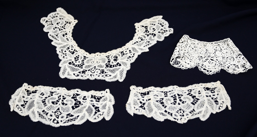 A matching collar and two cuffs for tight fitting sleeves, these fine lace items are done by