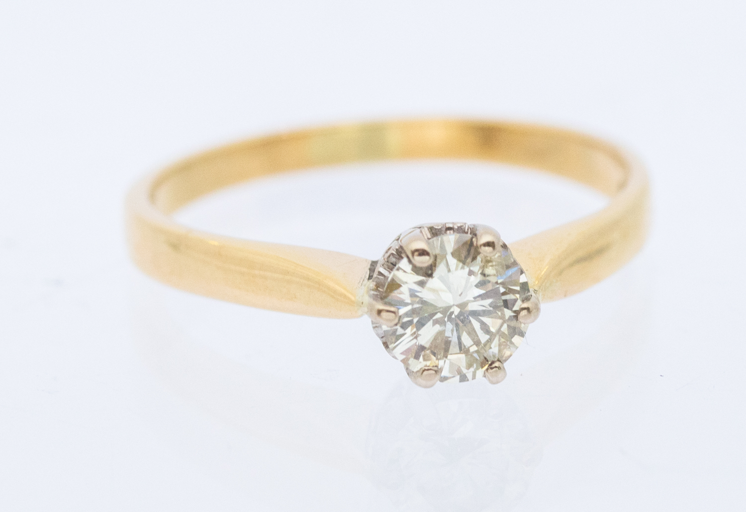 A diamond and 18ct gold solitaire ring, comprising a round brilliant cut diamond, approx diamond