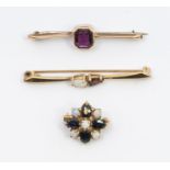 A garnet and opal 9ct gold bar brooch, set with pear shaped stones, length approx 45mm, along with a