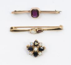 A garnet and opal 9ct gold bar brooch, set with pear shaped stones, length approx 45mm, along with a