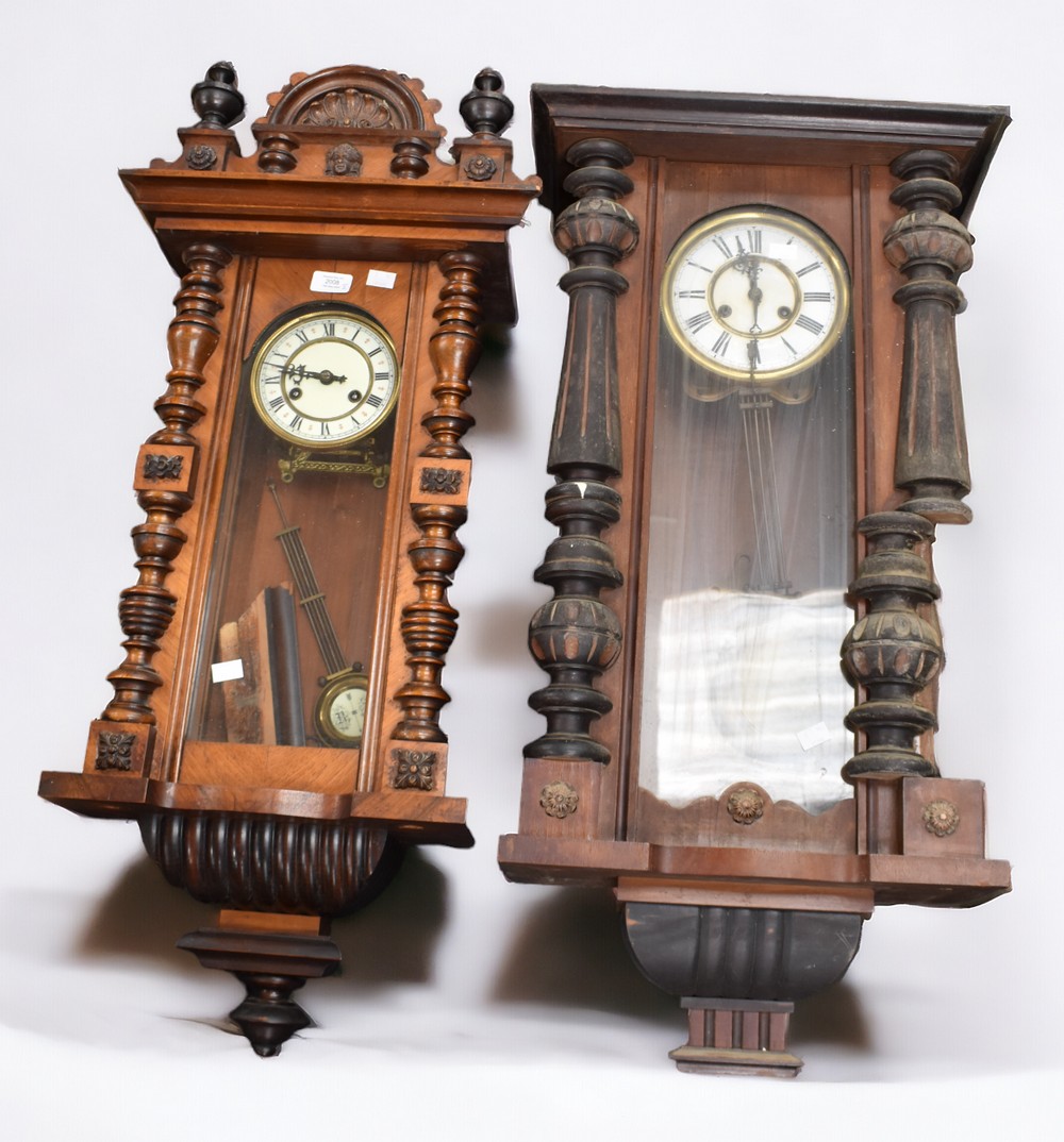 Two late 19th Century German mahogany 8 day wall clocks.