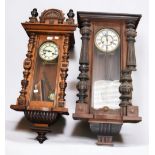 Two late 19th Century German mahogany 8 day wall clocks.