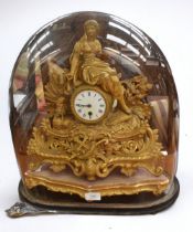A 19th century gilt brass French mantel clock, with original stand, with pendulum and key. Along