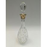 A 20th century tall crystal cut decanter, pin shaped with silver collar hallmarked by Charles S