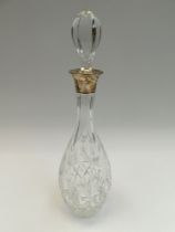 A 20th century tall crystal cut decanter, pin shaped with silver collar hallmarked by Charles S