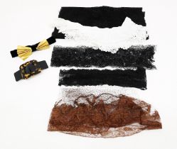 A small collection, including: black tulle/lace with a sequin decoration; a piece of black