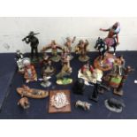 A collection of Native American resin figurines