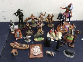 A collection of Native American resin figurines