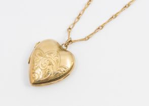 A gold front & back heart-shaped locket, suspended from a unmarked fancy link chain, combined weight