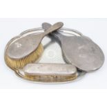 A matched Edwardian/George V silver dressing table set consisting of hand brush, mirror, clothes