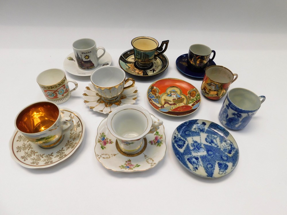 A collection of mid 20th Century cups and saucers with coffee cans and saucers, all different