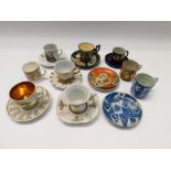 A collection of mid 20th Century cups and saucers with coffee cans and saucers, all different