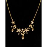 An Edwardian seed pearl and gold necklace, comprising an articulated front  of pearl set flower