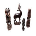 A collection of four East African tribal carved figures, hardwood and ebony.