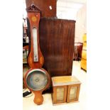 An Edwardian banjo barometer in mahogany along with an Edwardian smokers cabinet.