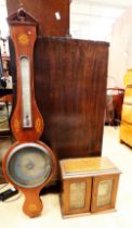 An Edwardian banjo barometer in mahogany along with an Edwardian smokers cabinet.