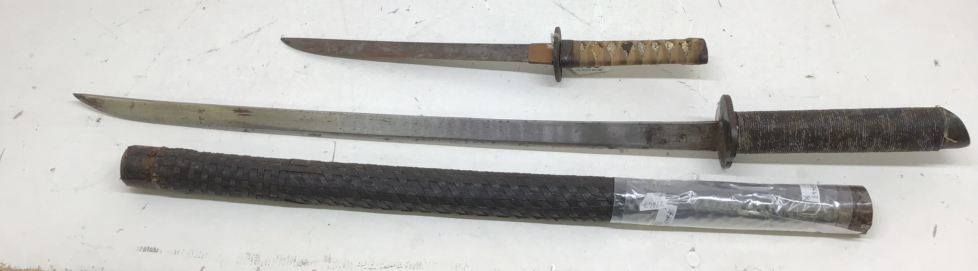 A Japanese Tanto Dagger with Period imitation Katana with heavy metal blade. Tanto Dagger has
