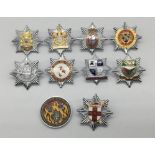 A selection of vintage chromed and enamelled fire service cap badges, and a RAF Lakenheath 48th