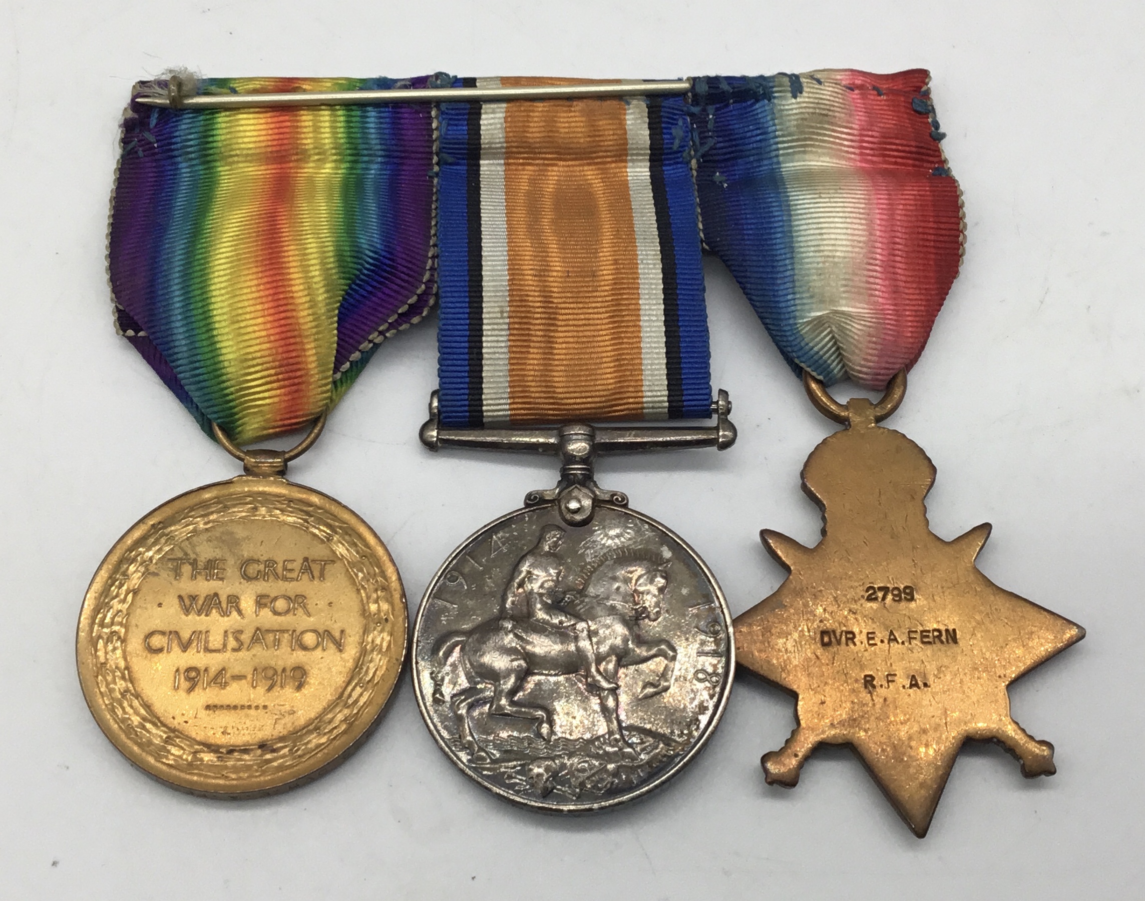 A WW1 1914 star trio, with sewn on clasp and silver war badge. Awarded to 2799 Dvr Edwin Arthur Fern - Image 4 of 6