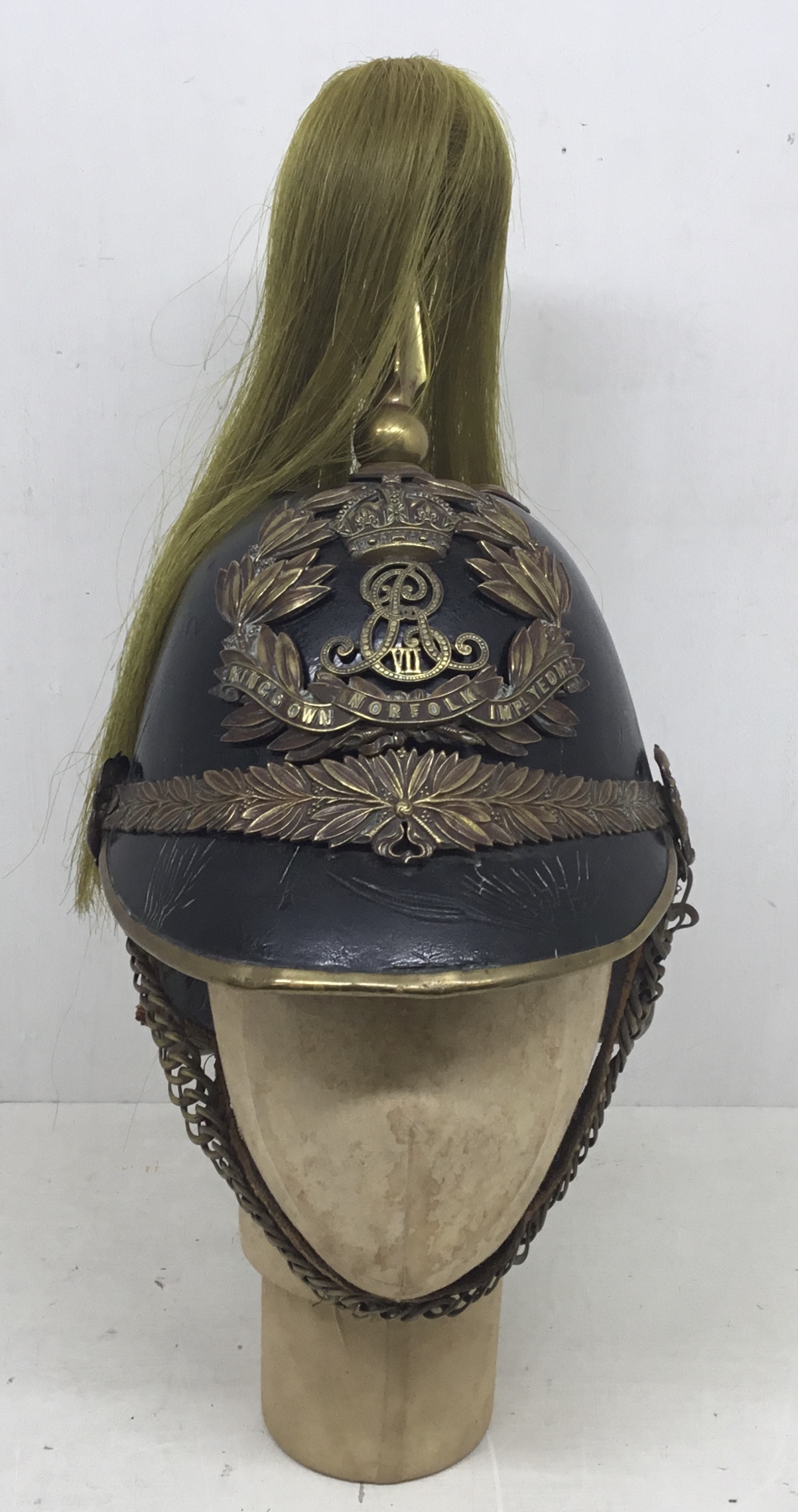 An early 20th century, Edwardian troopers helmet for the King’s Own Norfolk Imperial Yeomanry.