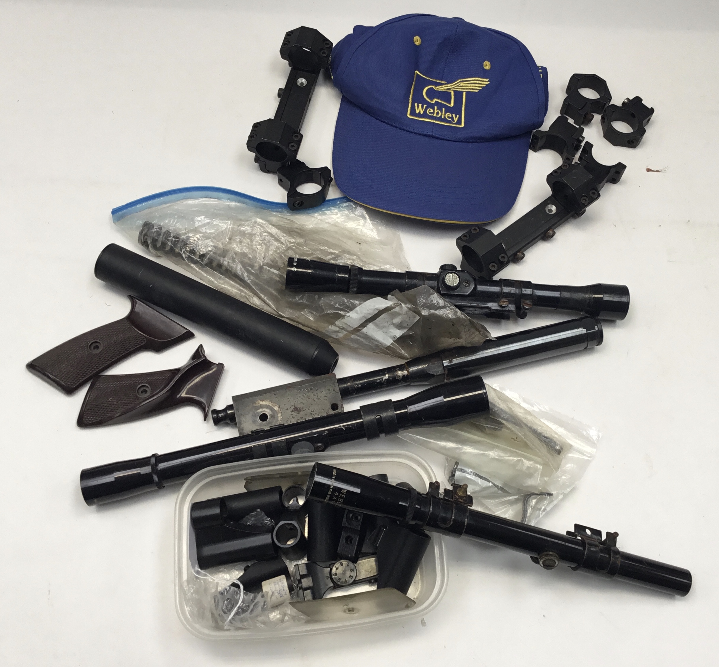 Collection of sights and other parts for Webley air pistols and rifles, plus a Webley baseball cap.