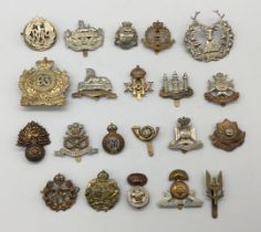 A quantity of WW1, WW2, and later British regimental cap badges. To include: a post WW2 military