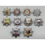 A selection of vintage chromed and enamelled fire service cap badges. To include: Great Yarmouth
