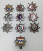 A selection of vintage chromed and enamelled fire service cap badges. To include: Bournemouth Fire