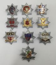 A selection of vintage chromed and enamelled fire service badges. To include: Lindsey Lincolnshire