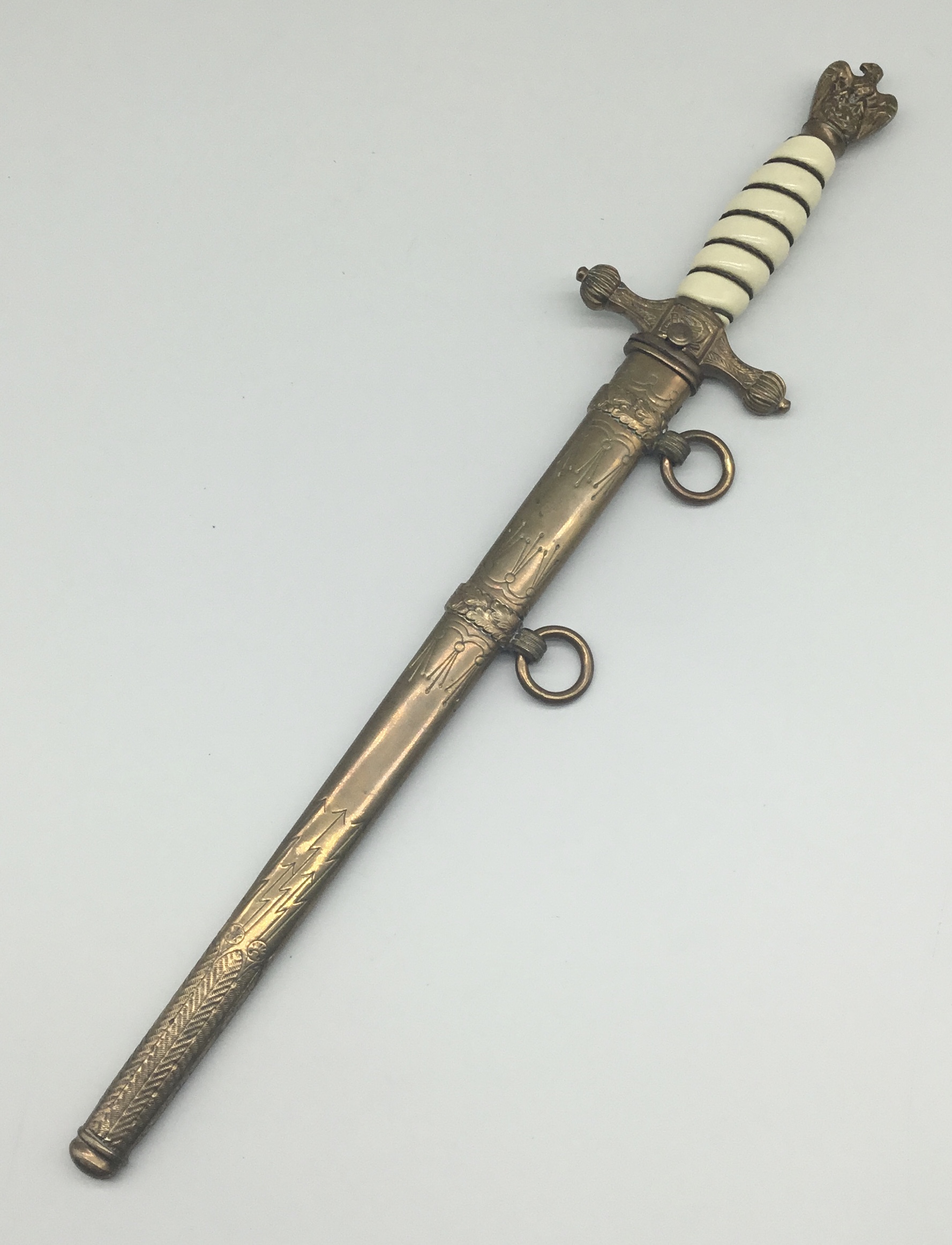A WW2 German Kriegsmarine officer's dagger, by F.W.Holler, Solingen. Off white / ivory coloured