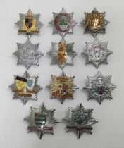 A selection of vintage chromed and enamelled fire service cap badges. To include: Cumberland Fire