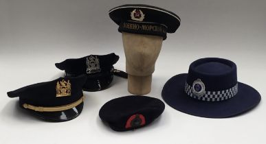 A selection of police and military headwear. To include: an Australian New South Wales Police bush