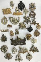 Collection of British Military Cap Badges of different regiments and brigades. Includes post war and