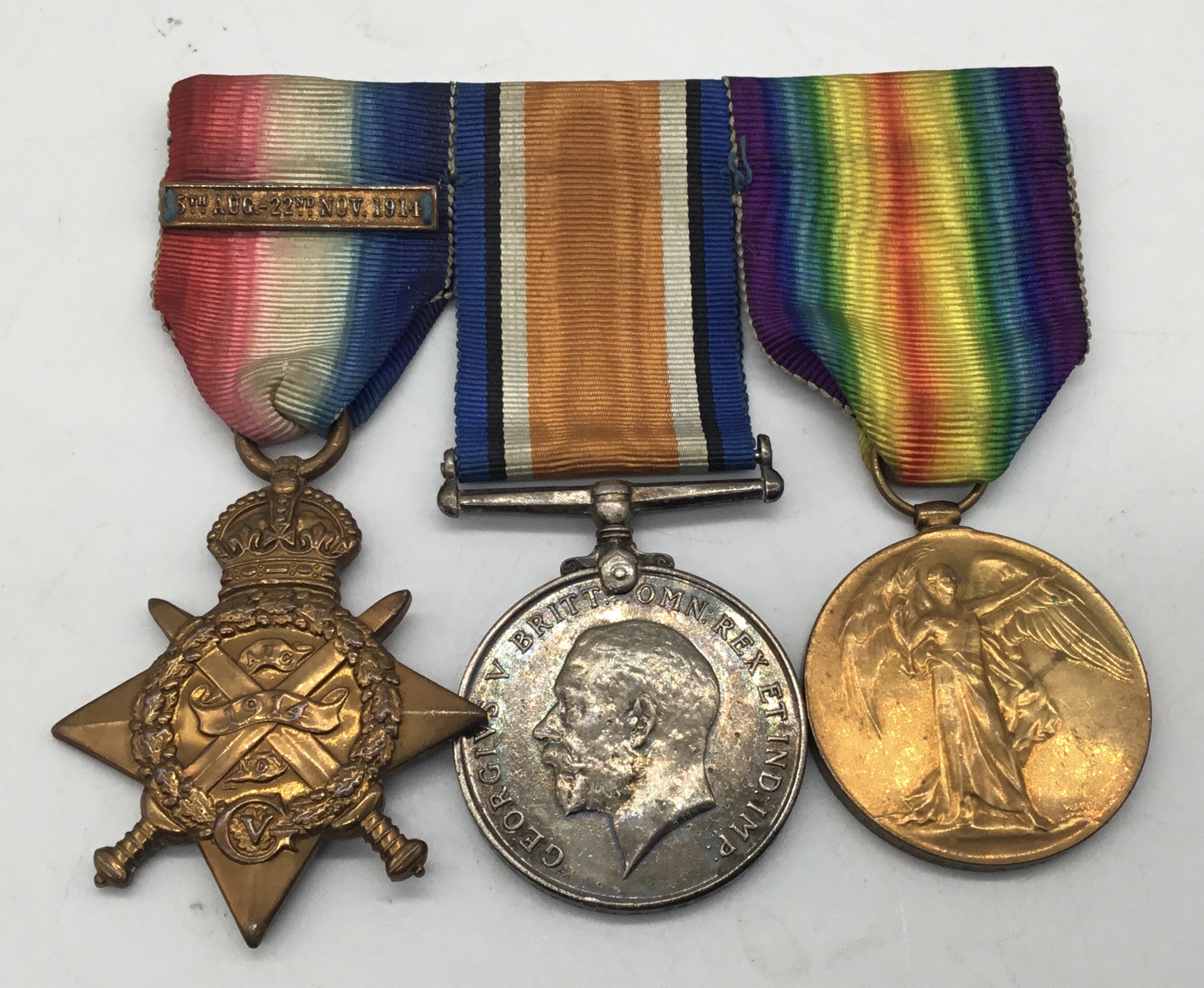 A WW1 1914 star trio, with sewn on clasp and silver war badge. Awarded to 2799 Dvr Edwin Arthur Fern - Image 2 of 6