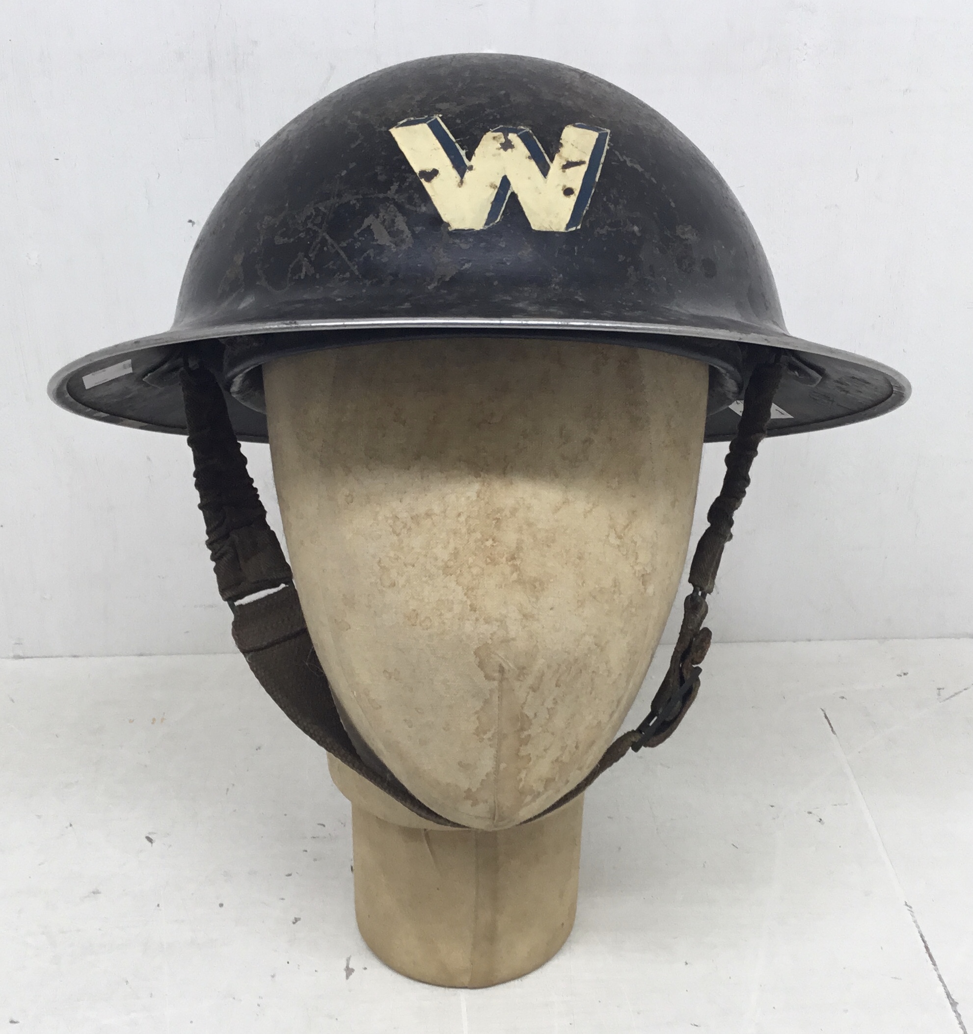 A WW2 era Air Raid Warden’s helmet. Dated 1939 to the underside of the rim, and stamped with the