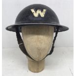 A WW2 era Air Raid Warden’s helmet. Dated 1939 to the underside of the rim, and stamped with the