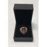 WW2 Interest, a 9ct gold ring inlaid with black lip oyster shell, over lid with what appears to be