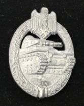 A WW2 German silver grade Panzer badge by Assault Hermann Aurich. Zinc with traces of a silver