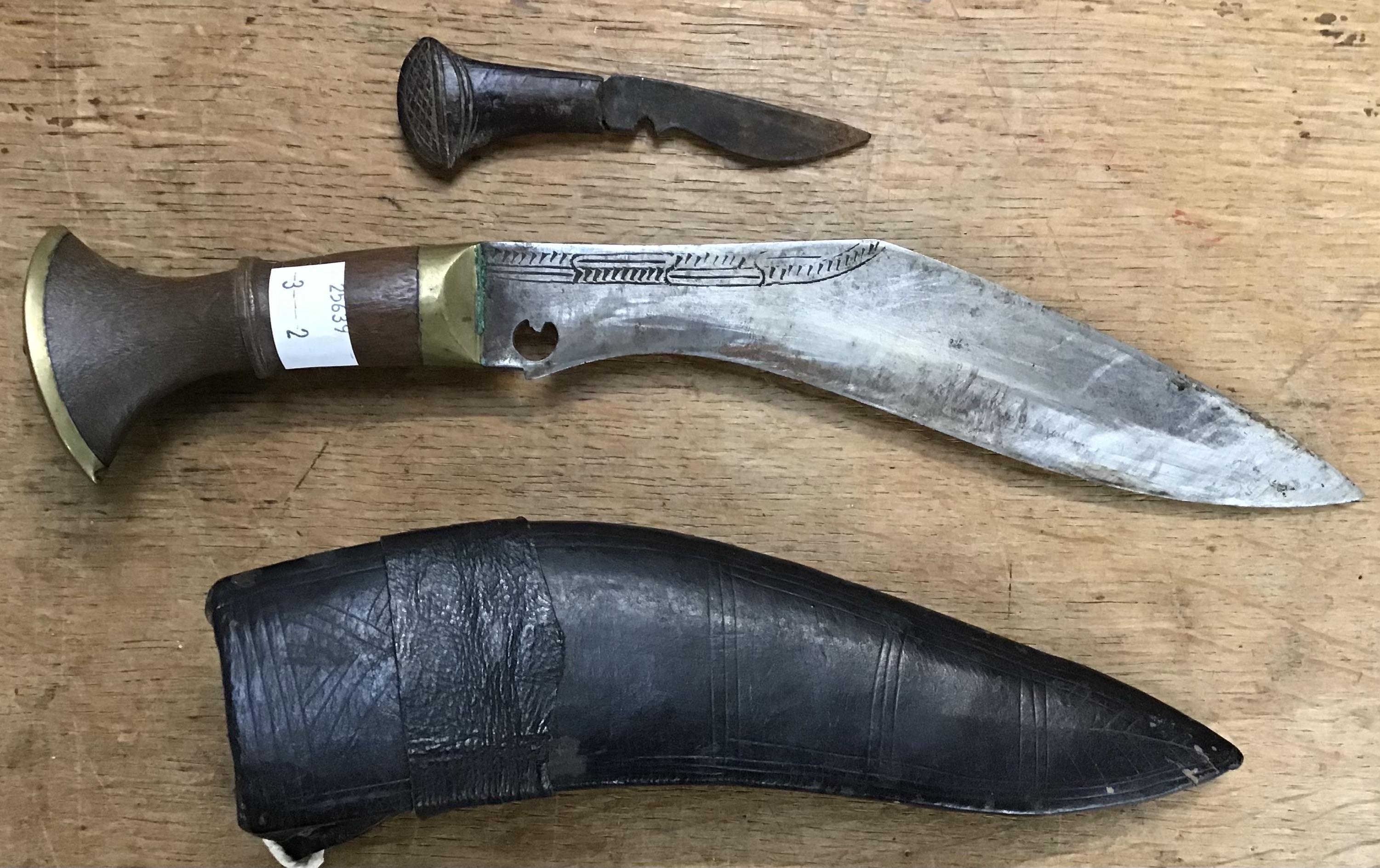A pair of post war Kukri knifes both with scabbards the larger is 39cm the smaller 30cm, both with - Image 2 of 3