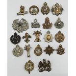 A quantity of WW1, WW2, and later British Military cap badges. To include: RAMC, Welsh Guards, Rifle