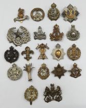 A quantity of WW1, WW2, and later British Military cap badges. To include: RAMC, Welsh Guards, Rifle