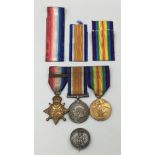 A WW1 1914 star trio, with sewn on clasp and silver war badge. Awarded to 2799 Dvr Edwin Arthur Fern
