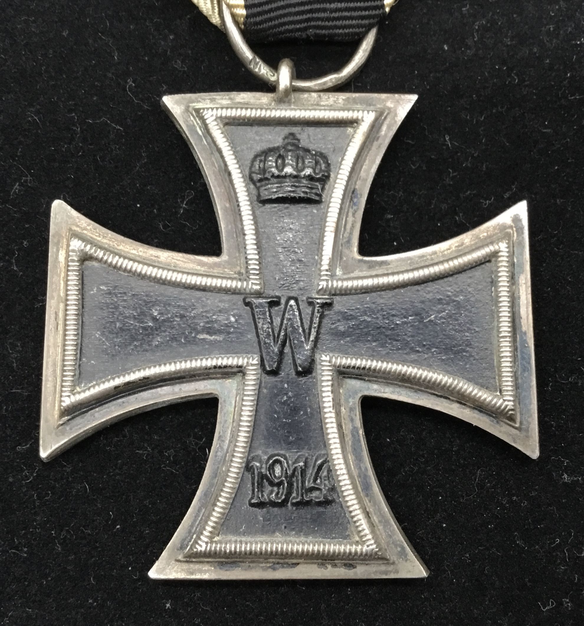A WW1 German Iron Cross 2nd class, complete with original ribbon. Maker marked S.W to the suspension - Image 3 of 4